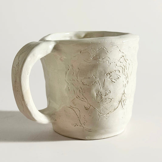 Handcrafted Clay Mug with Etched Faces